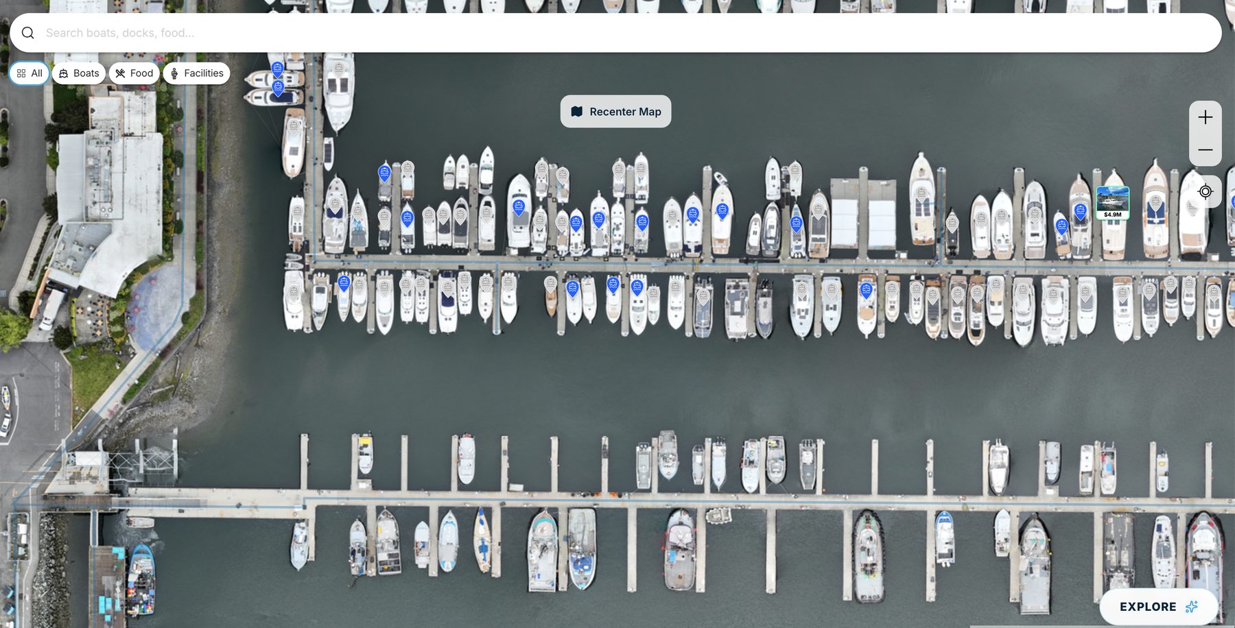 A full marina from above with boats pinned along every dock